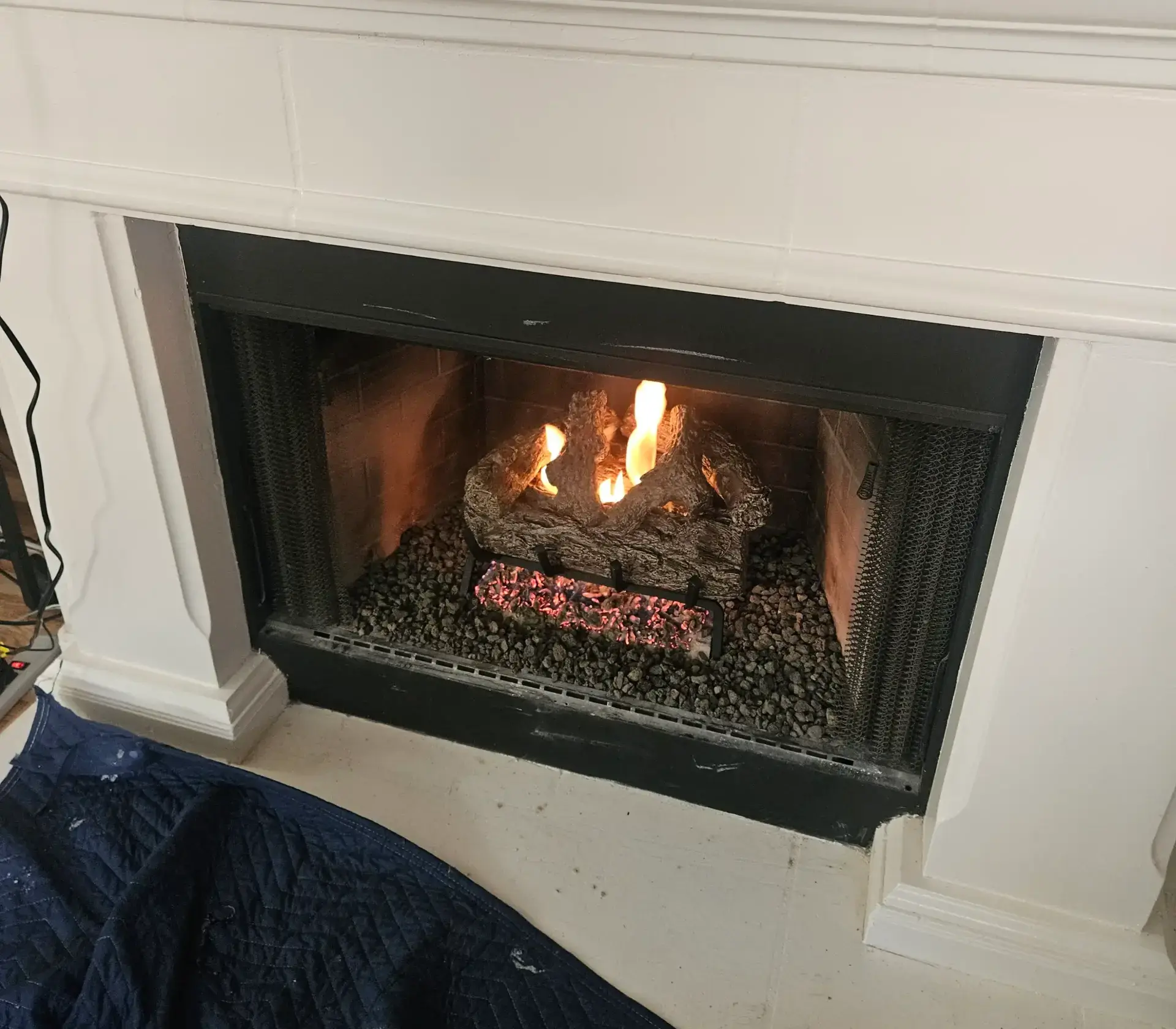 Gas log set burning after service